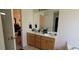 Bathroom featuring double sink vanity with drawers and cabinets at 903 Tucker Ln, Loganville, GA 30052
