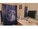 Bathroom featuring a single sink, mirror, and moon themed shower curtain at 903 Tucker Ln, Loganville, GA 30052