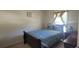 Cozy bedroom with a comfortable bed, neutral walls, and natural light from the window at 903 Tucker Ln, Loganville, GA 30052