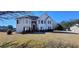 Charming two-story home with black shutters and a well-manicured lawn at 903 Tucker Ln, Loganville, GA 30052