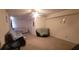 Cozy living room area featuring neutral colored carpet and ceiling fan at 903 Tucker Ln, Loganville, GA 30052
