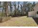 The backyard is flat and partially fenced at 505 S Malton S Ct, Stone Mountain, GA 30083