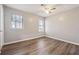 Cozy bedroom with laminate floors, natural light, and neutral walls at 505 S Malton S Ct, Stone Mountain, GA 30083