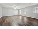 Large bedroom with three windows and vinyl plank flooring at 505 S Malton S Ct, Stone Mountain, GA 30083