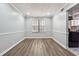 Cozy dining area with hardwood floors, neutral wall color, and lots of natural light at 505 S Malton S Ct, Stone Mountain, GA 30083