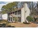Charming two-story home with black shutters and a large chimney nestled among mature trees at 505 S Malton S Ct, Stone Mountain, GA 30083