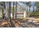 Traditional two-story home with a tree-lined driveway and a well-kept facade, offering a tranquil setting at 505 S Malton S Ct, Stone Mountain, GA 30083