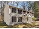 Classic two-story home with black shutters and a charming covered entrance, set on a spacious lot at 505 S Malton S Ct, Stone Mountain, GA 30083