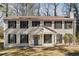 Charming two-story home with a classic white facade, black shutters, and a welcoming front porch at 505 S Malton S Ct, Stone Mountain, GA 30083
