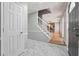Bright entryway with tile floors, leading to the living area with hardwood floors and brick fireplace at 505 S Malton S Ct, Stone Mountain, GA 30083