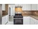 Kitchen featuring granite countertops, stainless appliances and tile backsplash at 505 S Malton S Ct, Stone Mountain, GA 30083