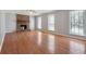 Spacious living room with wood burning fireplace, hardwood floors and lots of natural light at 505 S Malton S Ct, Stone Mountain, GA 30083