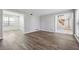Open-concept living room with seamless flow and hardwood floors, connecting to other rooms with natural light at 505 S Malton S Ct, Stone Mountain, GA 30083