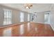Bright living room with hardwood floors and staircase access at 505 S Malton S Ct, Stone Mountain, GA 30083