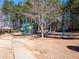 Community playground featuring a play structure, gazebo, basketball court, and seating areas at 5102 Staplehurst Ln, Woodstock, GA 30189