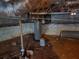The basement view reveals the water heater, ductwork, and cinder block foundation at 938 Rebel Forest Se Dr, Atlanta, GA 30315