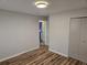 Bedroom featuring new hardwood floors, neutral walls, and a closet at 938 Rebel Forest Se Dr, Atlanta, GA 30315