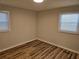A bedroom with windows and hardwood floors at 938 Rebel Forest Se Dr, Atlanta, GA 30315