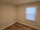 A bedroom with a window and new hardwood floors at 938 Rebel Forest Se Dr, Atlanta, GA 30315