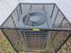 Close-up of HVAC unit encased in a security cage outdoors at 938 Rebel Forest Se Dr, Atlanta, GA 30315
