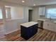 Kitchen featuring a center island with quartz countertop, new cabinets, and stainless steel dishwasher at 938 Rebel Forest Se Dr, Atlanta, GA 30315