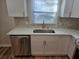 Kitchen area with quartz counters, stainless steel appliances, hexagon backsplash and gold fixtures at 938 Rebel Forest Se Dr, Atlanta, GA 30315