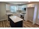 Modern kitchen featuring white cabinets, stainless steel appliances, and an island at 938 Rebel Forest Se Dr, Atlanta, GA 30315