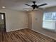 Cozy living room featuring wood-look flooring, natural light, and a ceiling fan at 938 Rebel Forest Se Dr, Atlanta, GA 30315