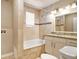 Bathroom featuring shower over tub, tiled walls, and granite vanity top at 1922 Willa Dr, Decatur, GA 30032