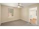 Cozy bedroom with plush carpet, neutral paint, and an ensuite bathroom at 1922 Willa Dr, Decatur, GA 30032