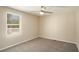 Bedroom includes a ceiling fan and large window providing natural light at 1922 Willa Dr, Decatur, GA 30032