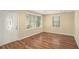 Bright living room with hardwood floors, a white front door, and natural light at 1922 Willa Dr, Decatur, GA 30032