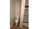 Modern bathroom featuring a toilet, a shower with a dark trim, and wood-look floors at 1965 Nocturne Dr # 1103, Alpharetta, GA 30009
