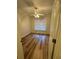 Well-lit bedroom featuring wood-look flooring, a ceiling fan, and a window with bright, natural light at 1965 Nocturne Dr # 1103, Alpharetta, GA 30009