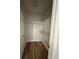 Walk-in closet featuring wire shelving and modern wood-look floors at 1965 Nocturne Dr # 1103, Alpharetta, GA 30009
