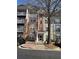 Charming condo building with well-maintained landscaping and inviting entryway at 1965 Nocturne Dr # 1103, Alpharetta, GA 30009