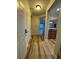 Inviting condo foyer with hardwood floors and open layout to the living area at 1965 Nocturne Dr # 1103, Alpharetta, GA 30009