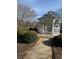 A peaceful gazebo with seating, nestled among trees and bushes, offers a relaxing outdoor space at 1965 Nocturne Dr # 1103, Alpharetta, GA 30009
