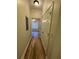 Hallway with wood-look flooring leading to a bedroom with natural light at 1965 Nocturne Dr # 1103, Alpharetta, GA 30009