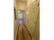 Hallway with closet and living room in background at 1965 Nocturne Dr # 1103, Alpharetta, GA 30009