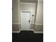 Condo hallway with neutral wall paint and modern door at 1965 Nocturne Dr # 1103, Alpharetta, GA 30009