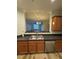 Kitchen with dark countertops, stainless steel appliances, wood floors at 1965 Nocturne Dr # 1103, Alpharetta, GA 30009