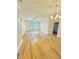 Bright living room with hardwood floors, a ceiling fan, and a modern chandelier at 1965 Nocturne Dr # 1103, Alpharetta, GA 30009