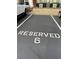 Reserved parking spot number 6 in a well-maintained parking lot, surrounded by greenery at 1965 Nocturne Dr # 1103, Alpharetta, GA 30009