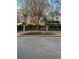Community signage for building and private property surrounded by beautiful landscaped grounds at 1965 Nocturne Dr # 1103, Alpharetta, GA 30009