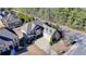 Stunning aerial view of the house showcasing its architectural design, and a spacious driveway at 4360 Autry Way, Alpharetta, GA 30022