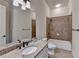 Bathroom with granite countertops, bathtub and shower featuring tile surround at 4360 Autry Way, Alpharetta, GA 30022