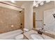 Bathroom features tiled shower, granite vanity and neutral color palette at 4360 Autry Way, Alpharetta, GA 30022