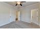 Bright bedroom with a ceiling fan, and multiple doorways leading to other rooms at 4360 Autry Way, Alpharetta, GA 30022