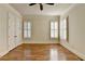 Bedroom featuring hardwood floors, crown molding and natural light at 4360 Autry Way, Alpharetta, GA 30022
